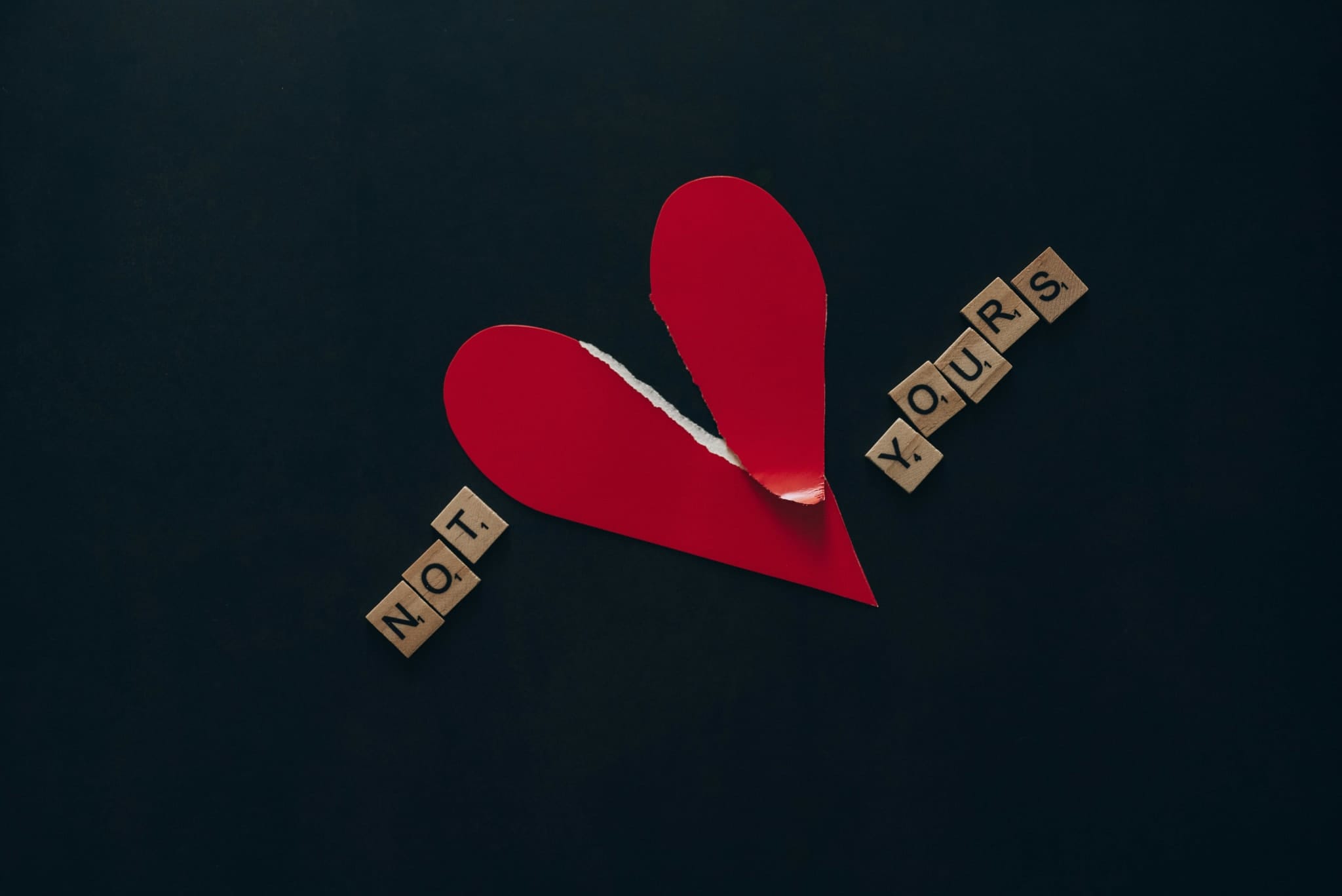 Photo by Leeloo The First: https://www.pexels.com/photo/wooden-scrabble-tiles-on-black-background-6694114/